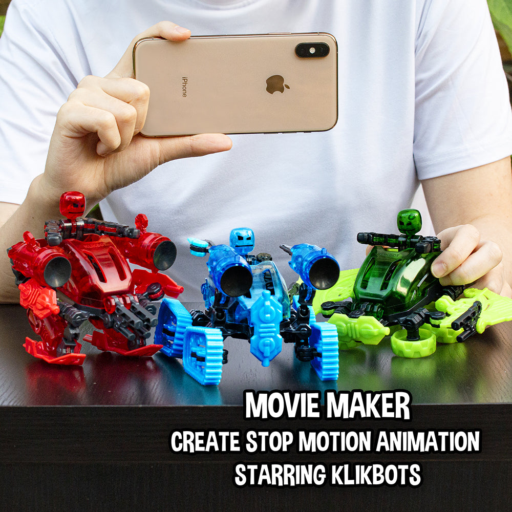 Person filming KlikBot Megabot vehicles with smartphone for stop motion animation