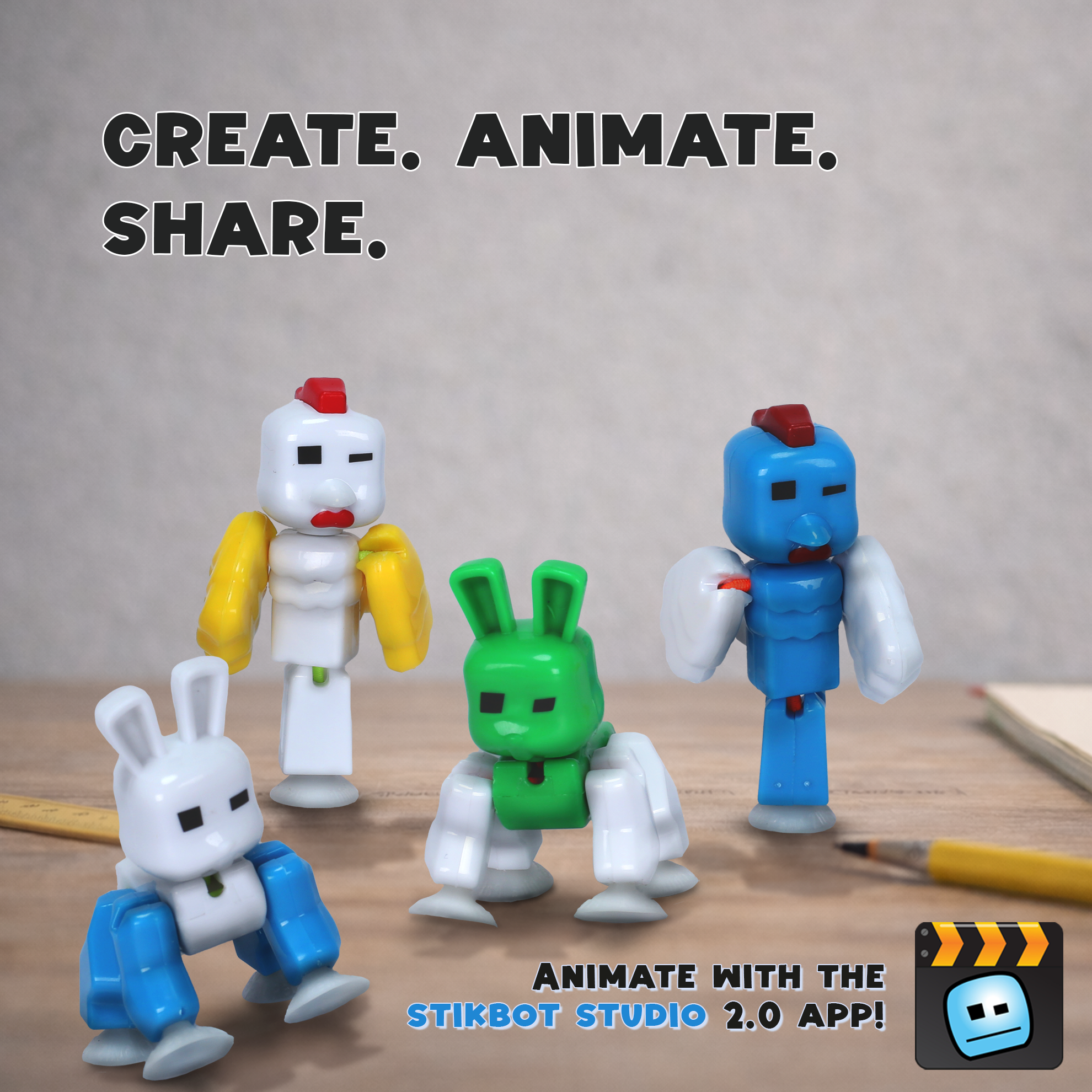 CluckBot and BunnyBot KlikBot figures posed on desk for stop motion animation