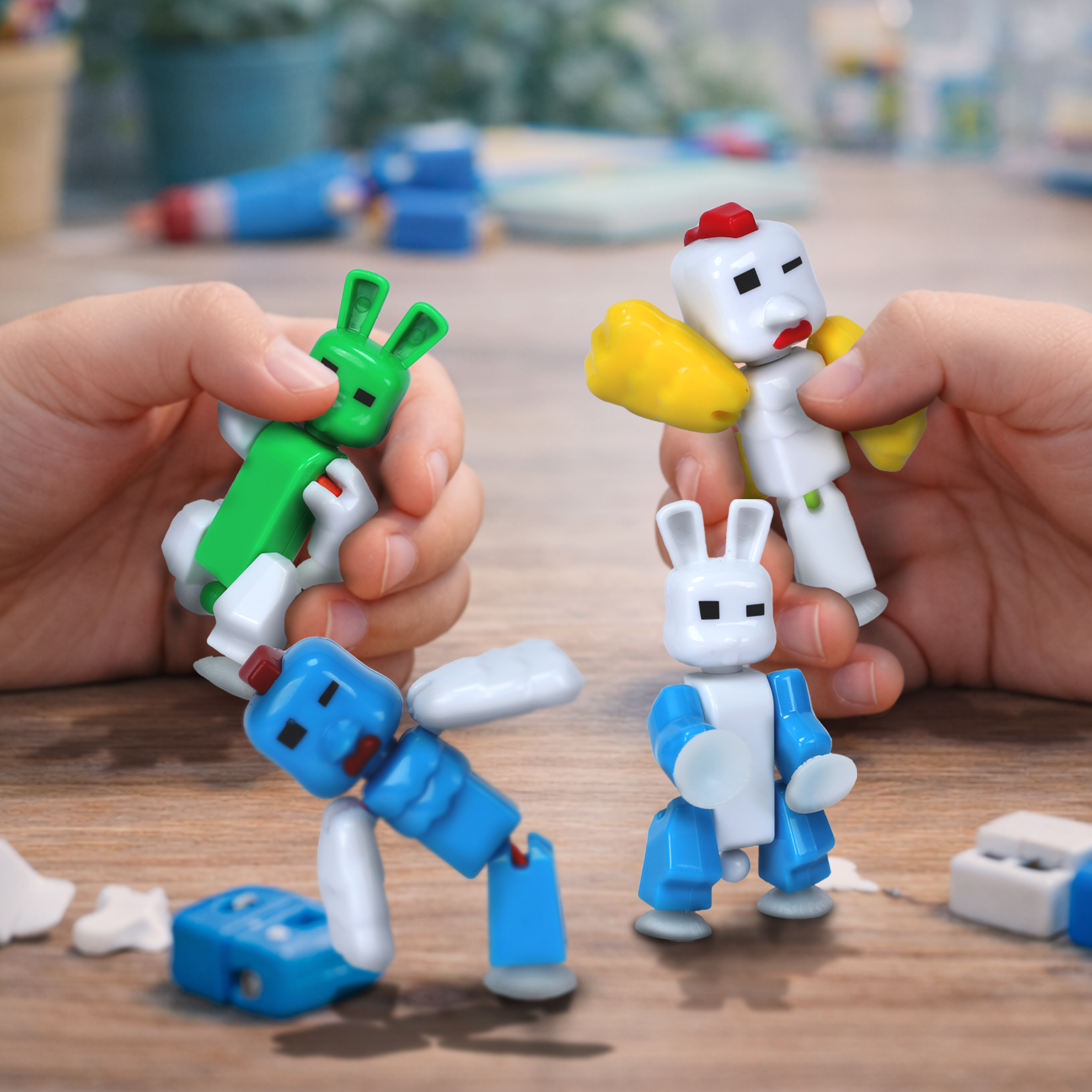 Kids playing with KlikBot CluckBot and BunnyBot figures with removable parts