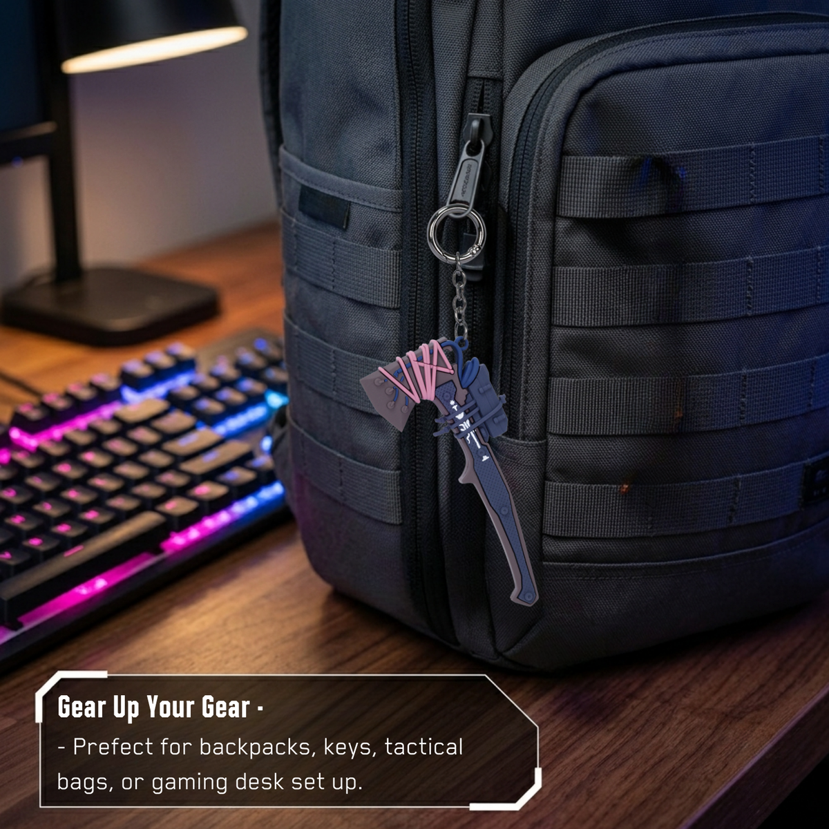 Cyberpunk 2077 Cut-O-Matic chainsword keychain clipped to a backpack beside a gaming keyboard
