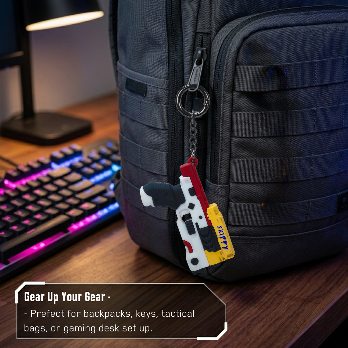 Cyberpunk 2077 Skippy pistol keychain clipped to a black backpack beside a gaming keyboard