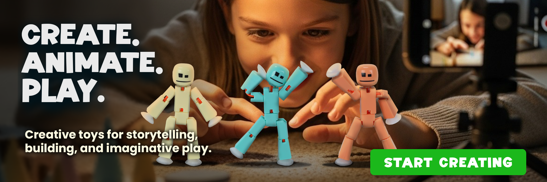Kids creating stop motion animation with Stikbot toys on a smartphone tripod